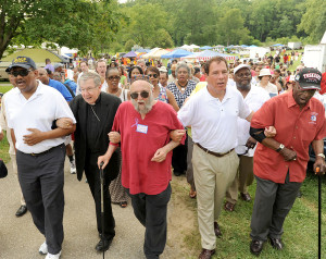 Woodlawn (Baltimore), MD- 7/7/13-Civil rights activists from the 60's and others sing freedom songs as they take part in the Unity Walk to the Historical Marker at Gwynn Oak Amusement Park to commemorate the 50th anniversary of the desegregation of the park. From left: Tony Fugett, President of Baltimore county Chapter of the NAACP; Bishop Denis J. Madden, Archdiocese of Baltimore; Rabbi Arthur Waskow; Baltimore County Executive Kevin Kamenetz; and Cyril O. Byron, Sr. Ed.D, a Tuskegee Airman. The desegregation of the Park was a defining moment in Baltimore civil rights history. Algerina Perna/Baltimore Sun, #8564.